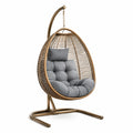 Sillón colgante de ratán y metal con cojín gris